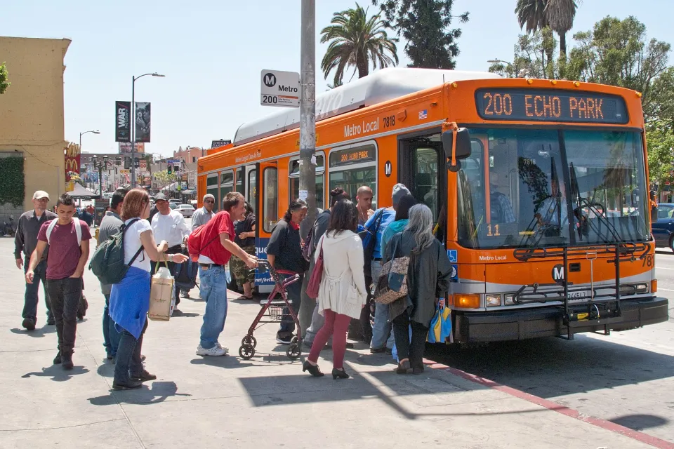 People boarding bus at LA Metro Bus Stop, Alvarado Street, Los Angeles